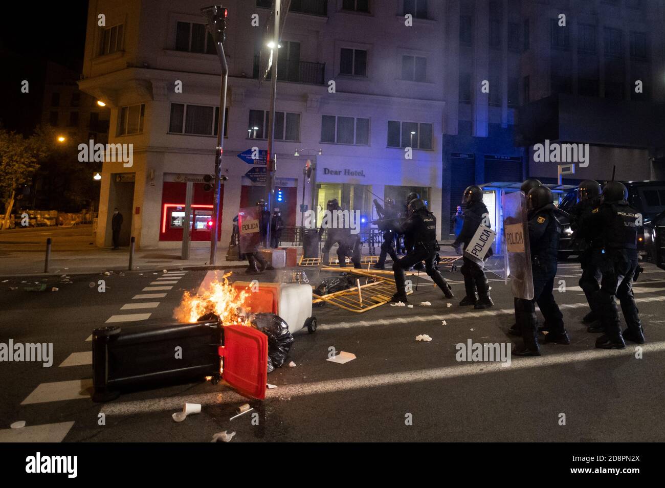 Madrid, Spain. 01st Nov, 2020. Riot police firing rubber bullets and gas during a protest against the Government's coronavirus (Covid-19) pandemic restrictions defying curfew. Credit: Marcos del Mazo/Alamy Live News Stock Photo