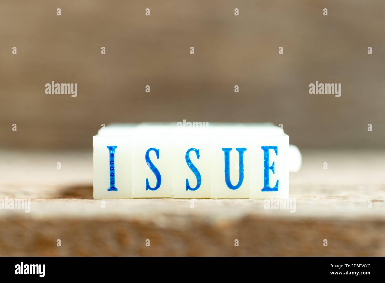 Letter block with blue color word issue on wood background Stock Photo ...