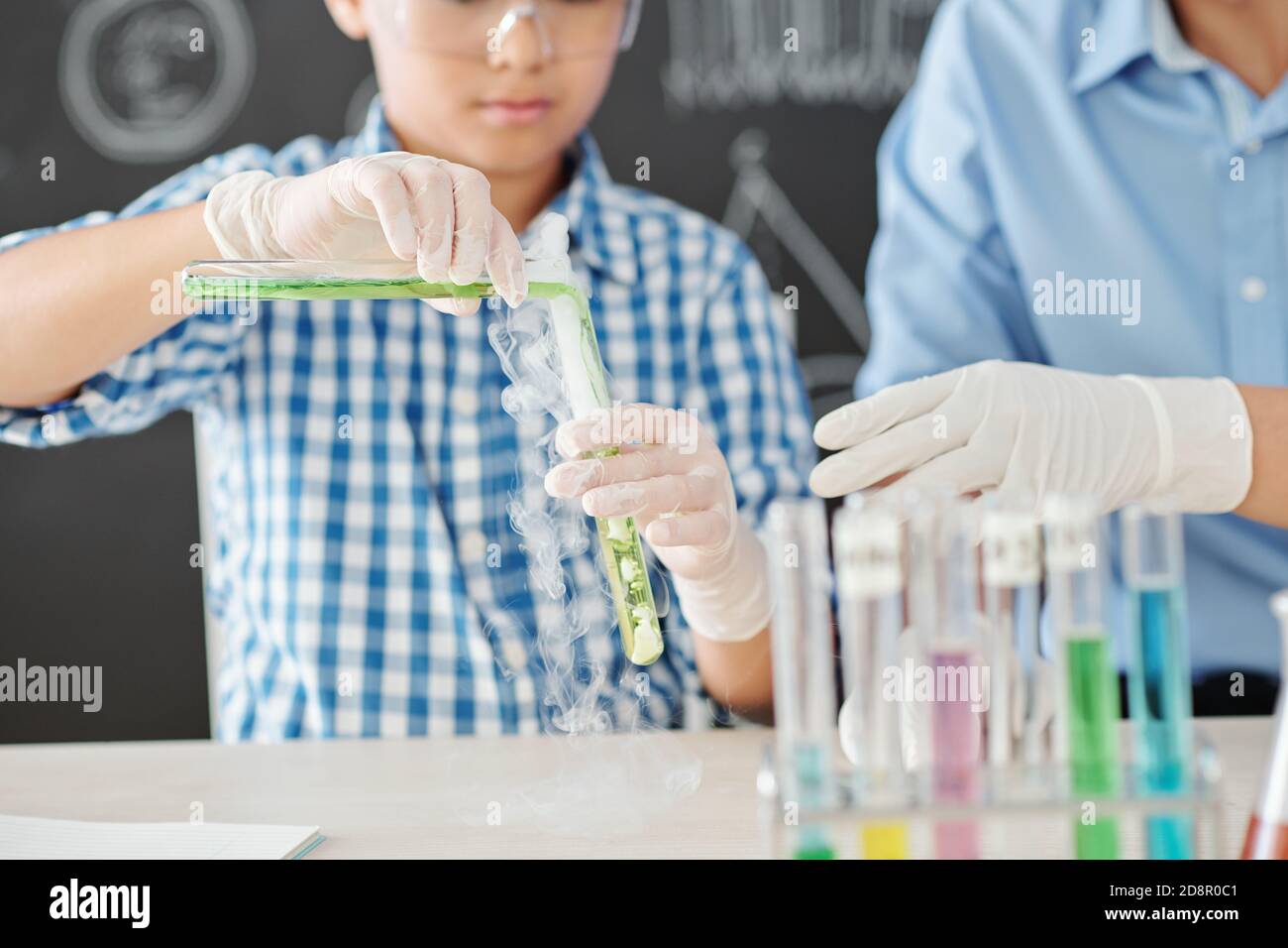 Student mixing chemical liquids Stock Photo Alamy