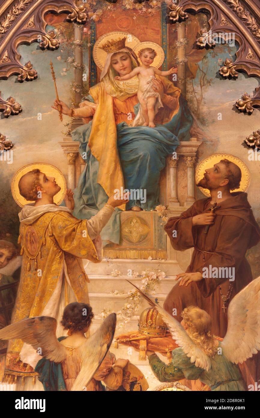 VIENNA, AUSTIRA - OCTOBER 22, 2020:  The painting of Madonna wiht the S. Laurence and St. Francis of Assisi in  church Laurentiuskirche by Hans Zacka Stock Photo