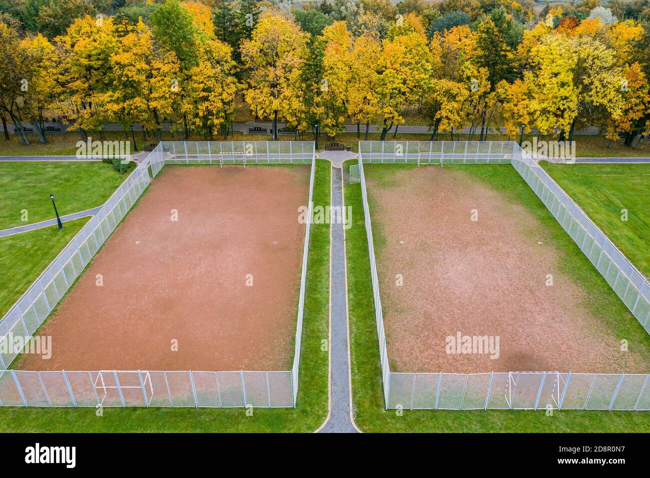 two sports ground for team games of sport in autumn park. aerial view