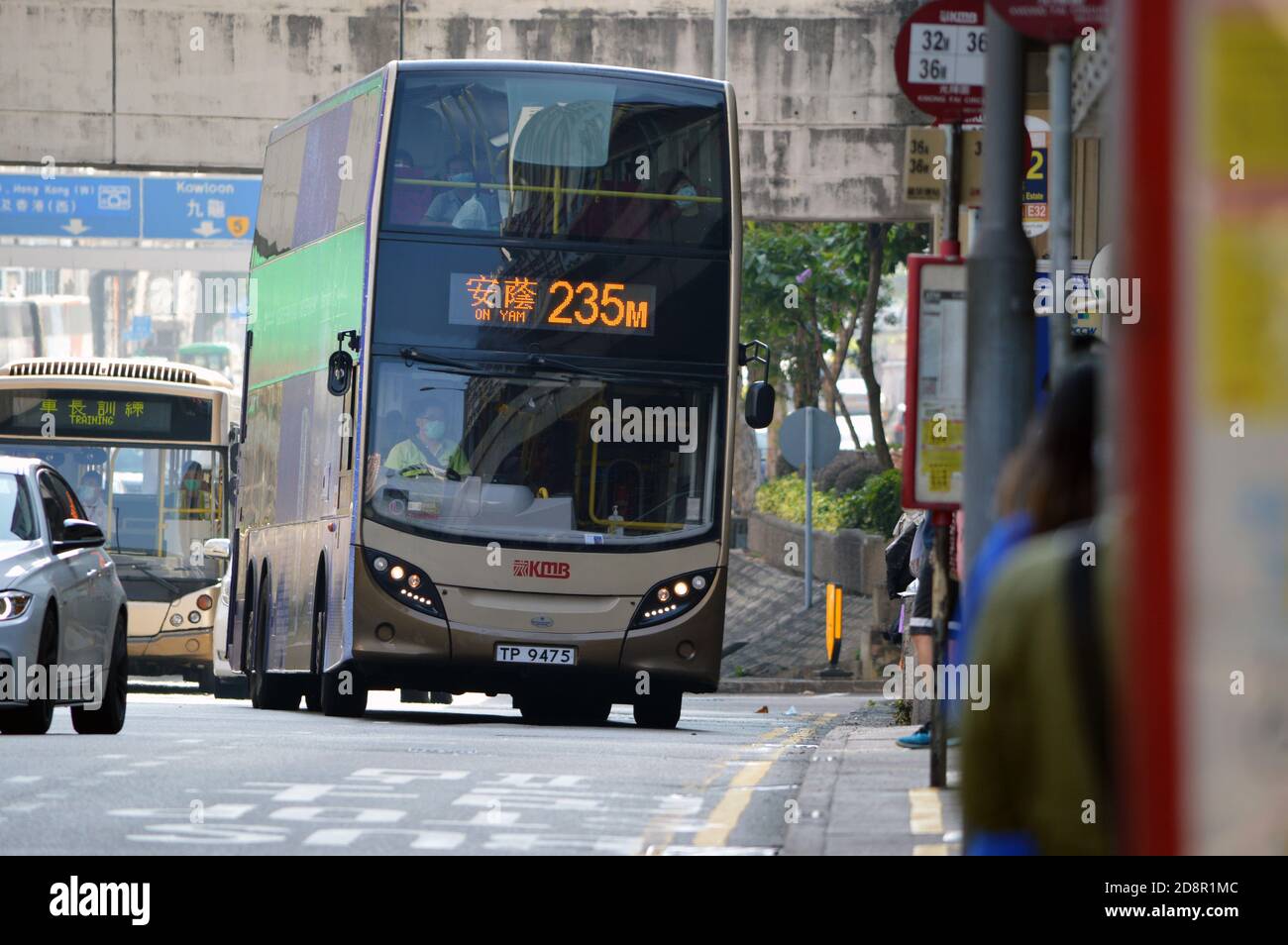 Kowloon Motor Bus (KMB) route 235M bus approaching a bus stop on Kwai Chung  Road in Kwai Chung, Hong Kong Stock Photo - Alamy