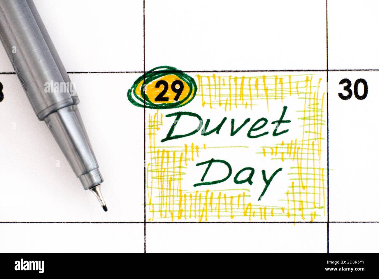 Reminder Duvet Day in calendar with pen. Close-up Stock Photo