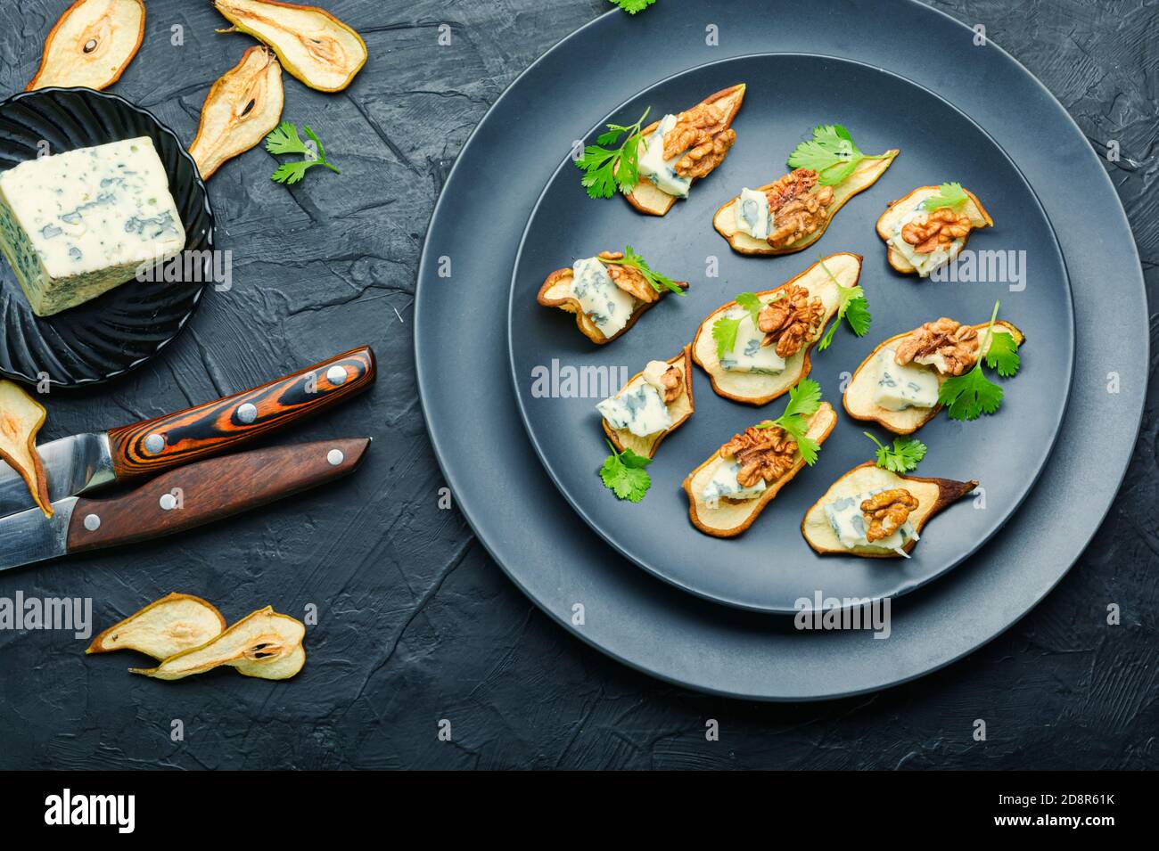 Dry pear,blue cheese and walnut appetizer.Seasonal snack Stock Photo