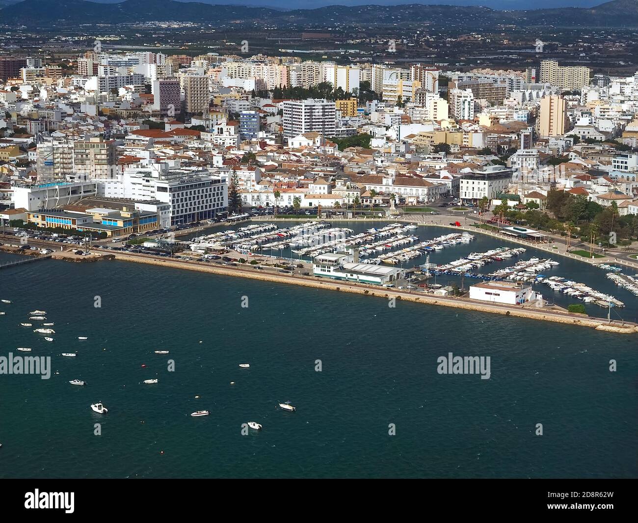 Aerial view of the Cityscape of Faro at the Algarve coast in Portugal seen from an airplane Stock Photo