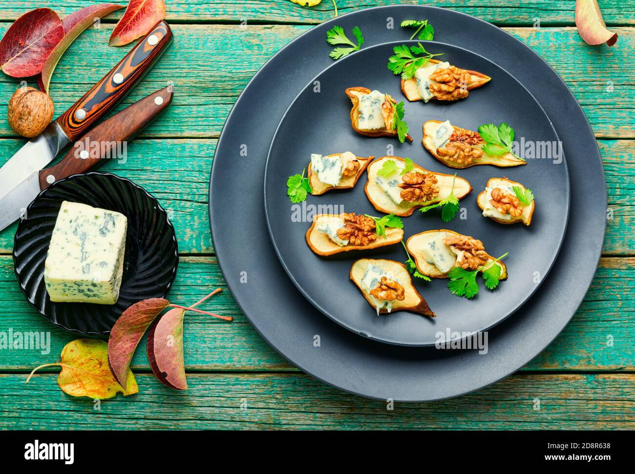 Dry pear,blue cheese and walnut appetizer.Sliced dried pear pieces