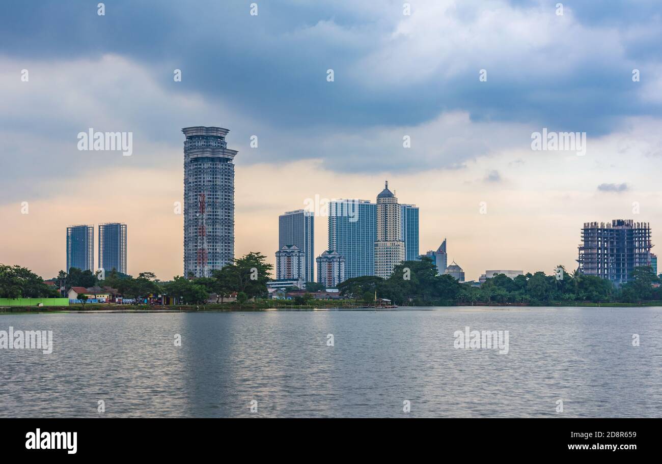 Tangerang, Indonesia - 5th January 2018: A view of Kelapa Dua Lake in the foreground and Lippo Karawaci district buildings in the background. Taken in Stock Photo