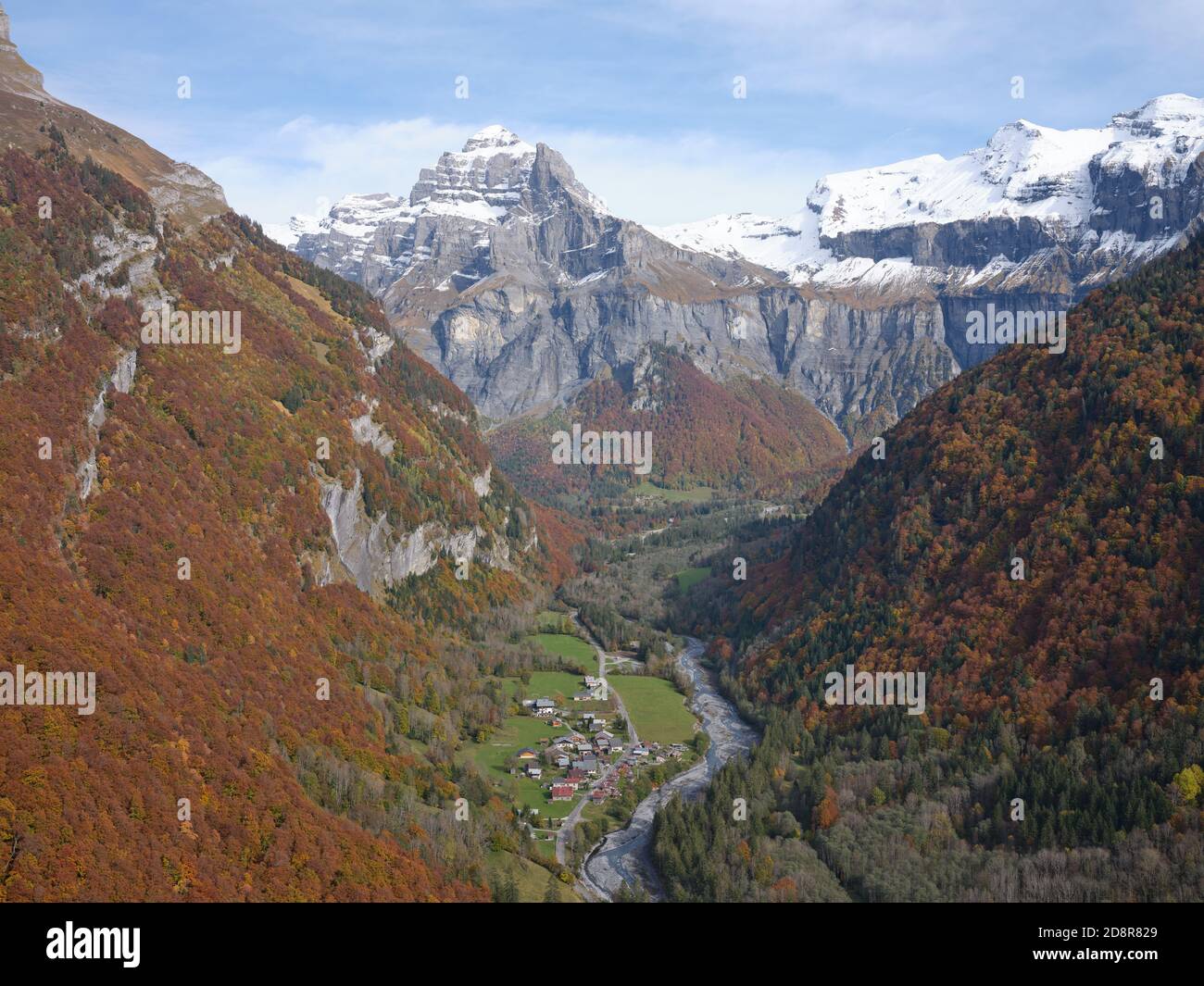 AERIAL VIEW. The sparsely populated Giffre Valley looking upstream towards the 2989-meter-high Tenneverge Peak. Nambride, Sixt-Fer-à-Cheval, France. Stock Photo