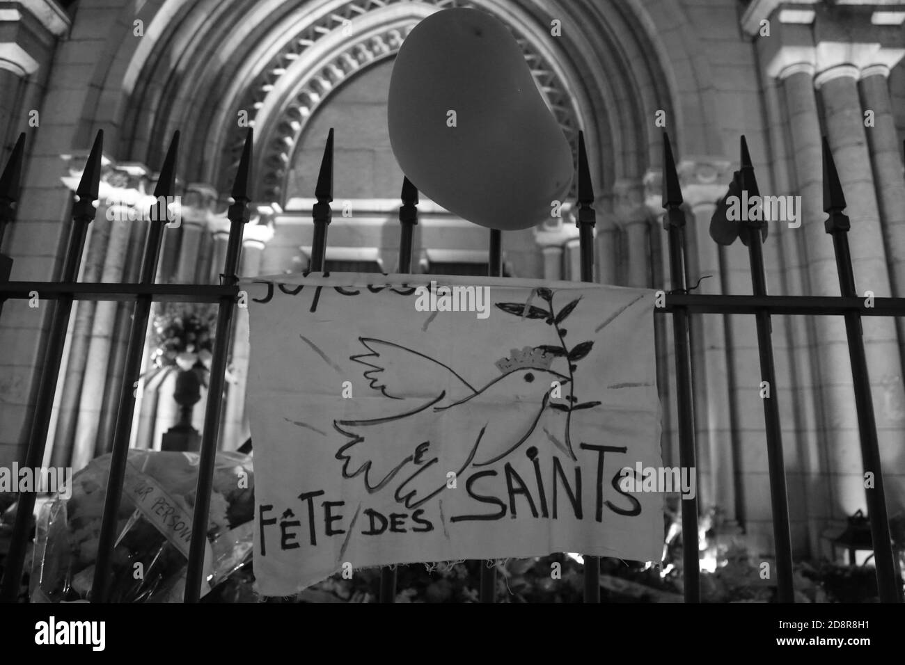 Nice, France. October 31, 2020: Nice, France. 31 October 2020. A vigil is held outside the Notre Dame basilica in Nice to remember the victims of a knife attack at the church during which three people were killed and several others injured on Thursday. Participants laid flowers to remember the victims and wrote messages condemning the 'barbarity of the attack'' and upholding the republic's core values. Credit: ZUMA Press, Inc./Alamy Live News Stock Photo