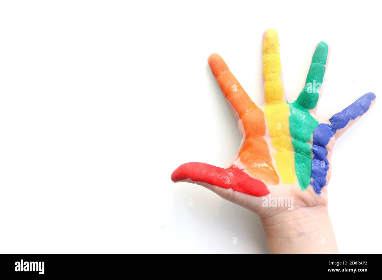 Rainbow painted hand shape isolated on white. Hand painted rainbow