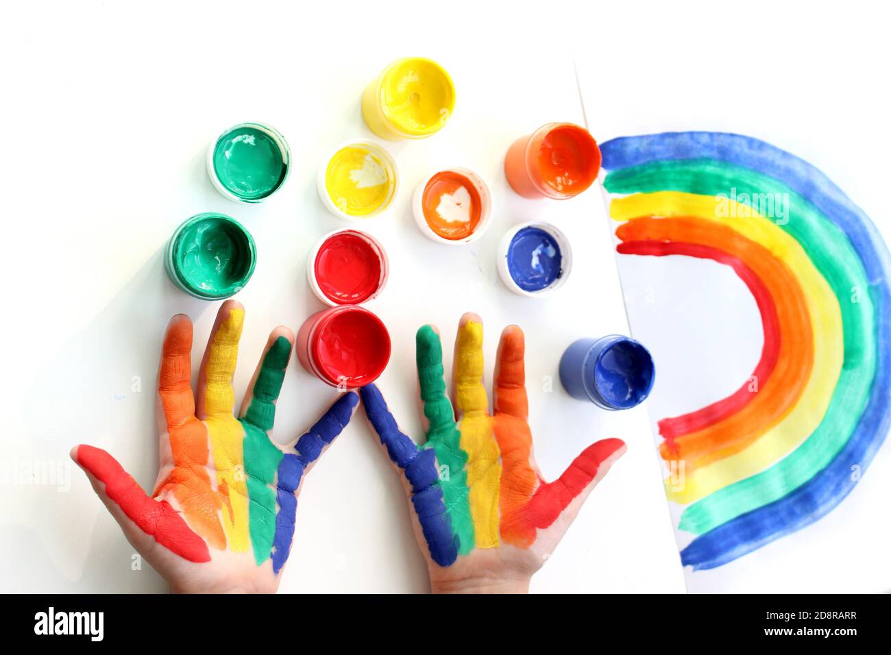 Rainbow painted hand shape isolated on white. Hand painted rainbow