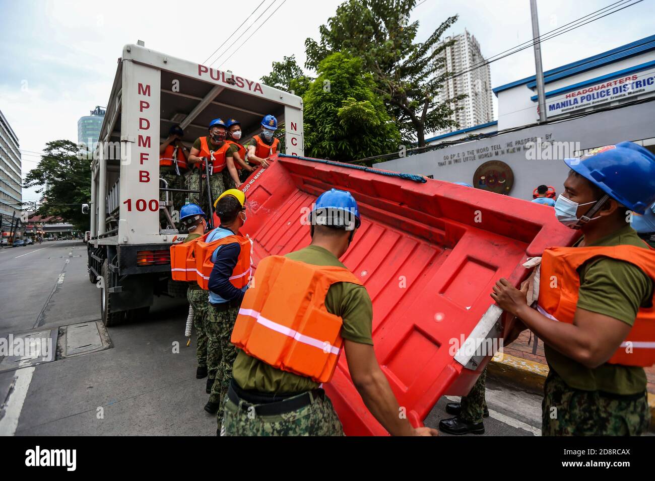 Manila, Philippines. 1st Nov, 2020. Members of the Manila Police District Mobile Force Battalion of the Philippine National Police (PNP) board a truck as they are deployed to evacuate residents in coastal areas due to the heavy rains and strong winds from typhoon Goni in Manila, the Philippines, on Nov. 1, 2020. Between 19 to 31 million people in the Philippines, about a quarter of the country's population, could be affected by Super Typhoon Goni, the country's disaster body said on Sunday. Credit: Rouelle Umali/Xinhua/Alamy Live News Stock Photo