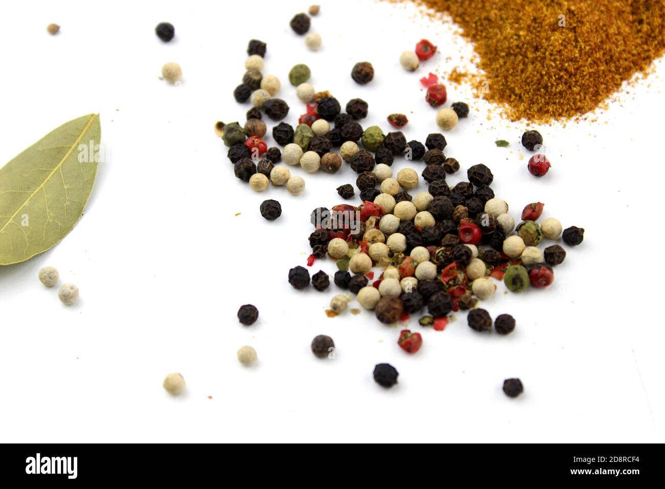 Wide variety spices and herbs on background of white table, with empty space for text or label Stock Photo