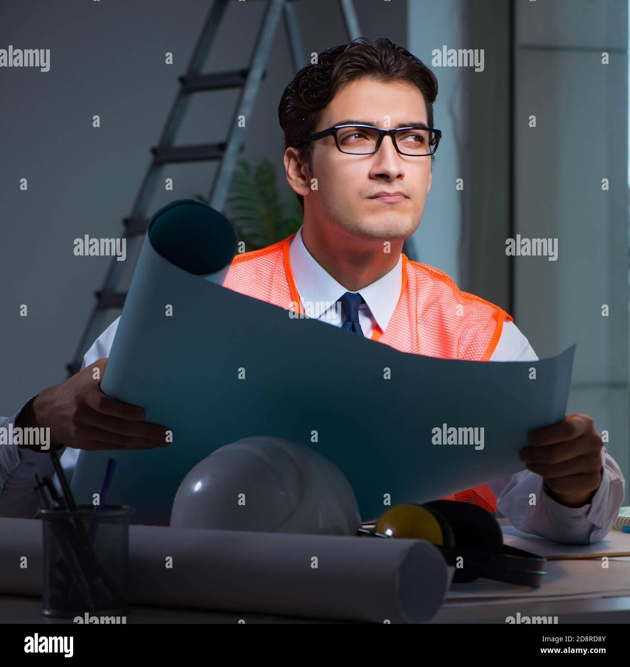 The construction architect working on drawings late at night Stock ...