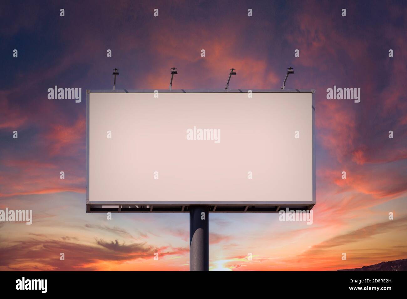 Blank billboard mock up for advertising, against blue sky Stock Photo
