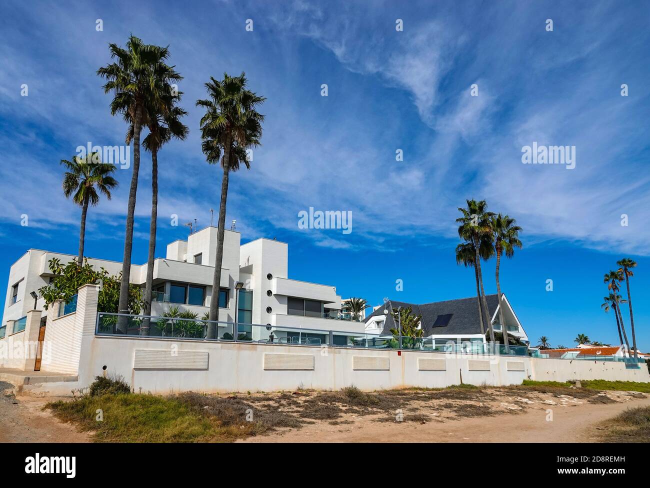 Big and impressive beach front property the palm trees hires stock