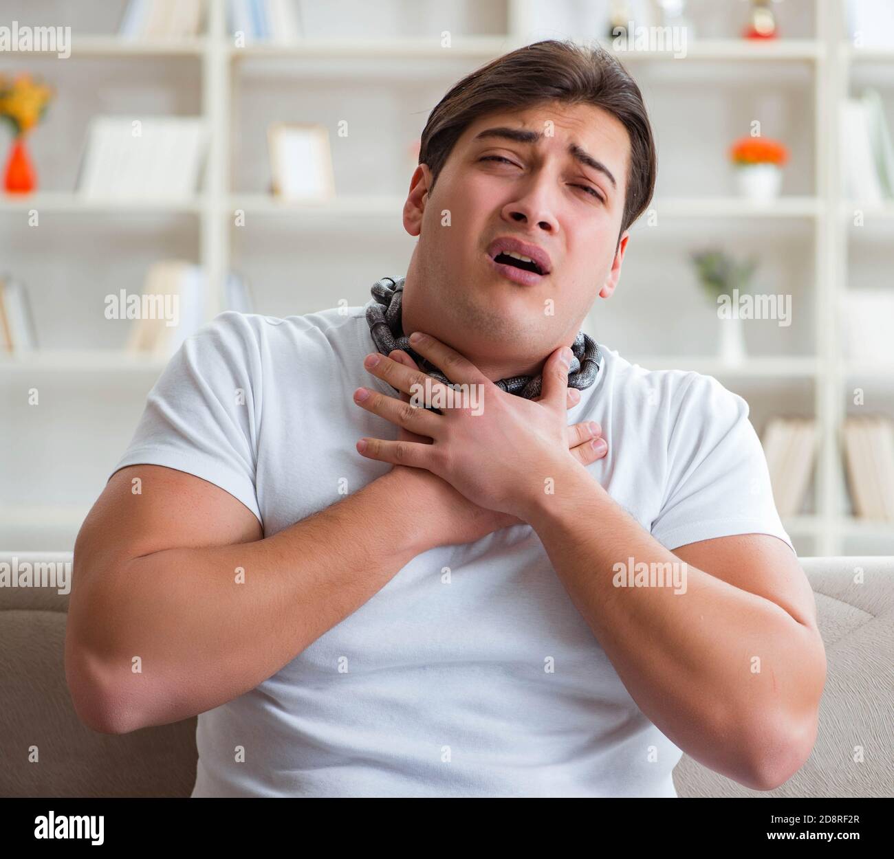 The young man suffering from sore throat Stock Photo Alamy