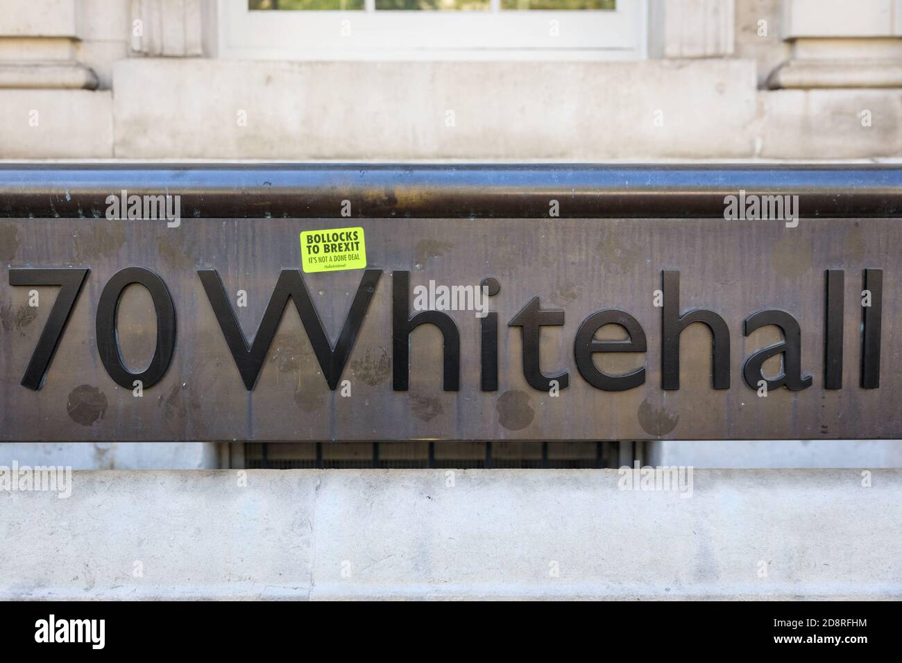 '70 Whitehall', Cabinet Office sign with anti Brexit sticker outside government building, Westminster, London, UK Stock Photo