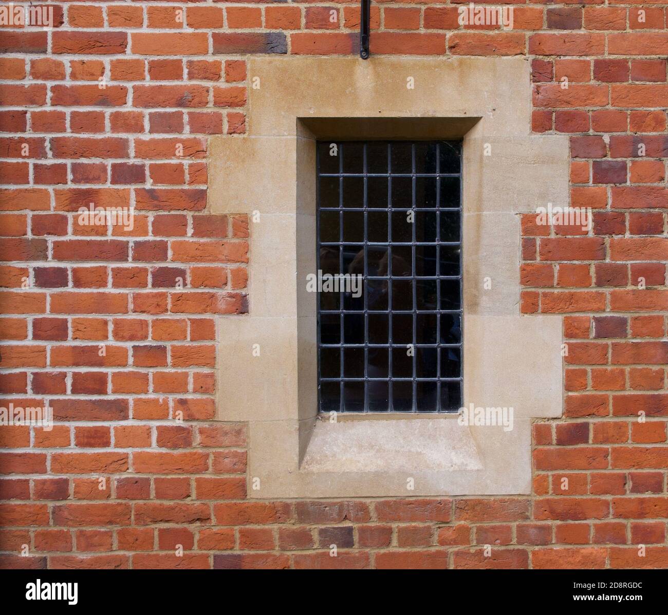 Architectural feature showing old fashioned window embedded in brick