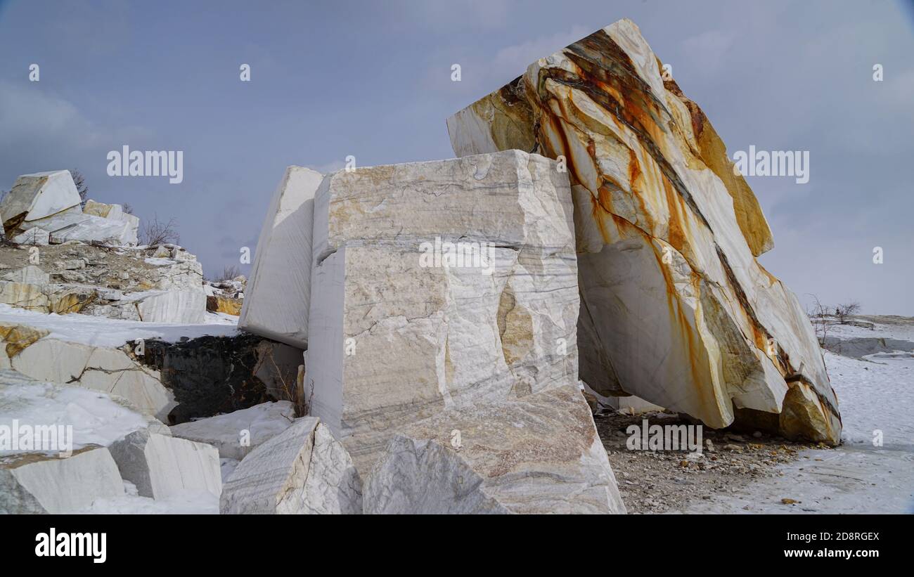 abandoned marble quarry on the background of hills and lake Baikal