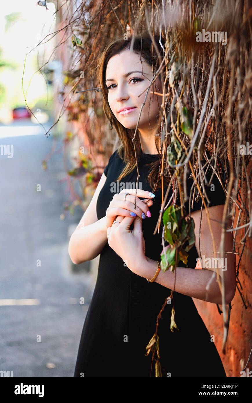 Beautiful woman in black dress walking hi-res stock photography and ...