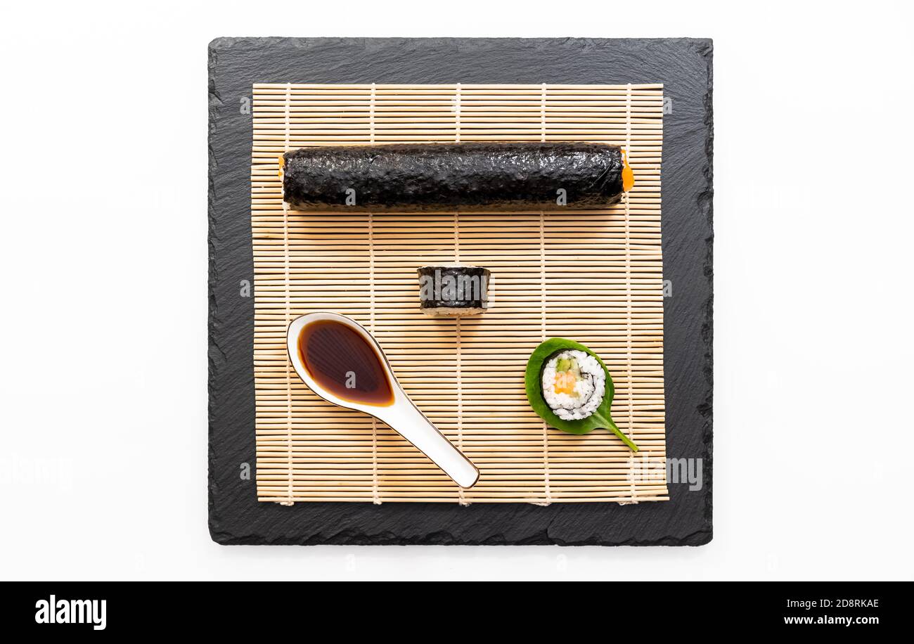 Presentation of Japanese cooking dish, sushi and maki on black background. Stock Photo