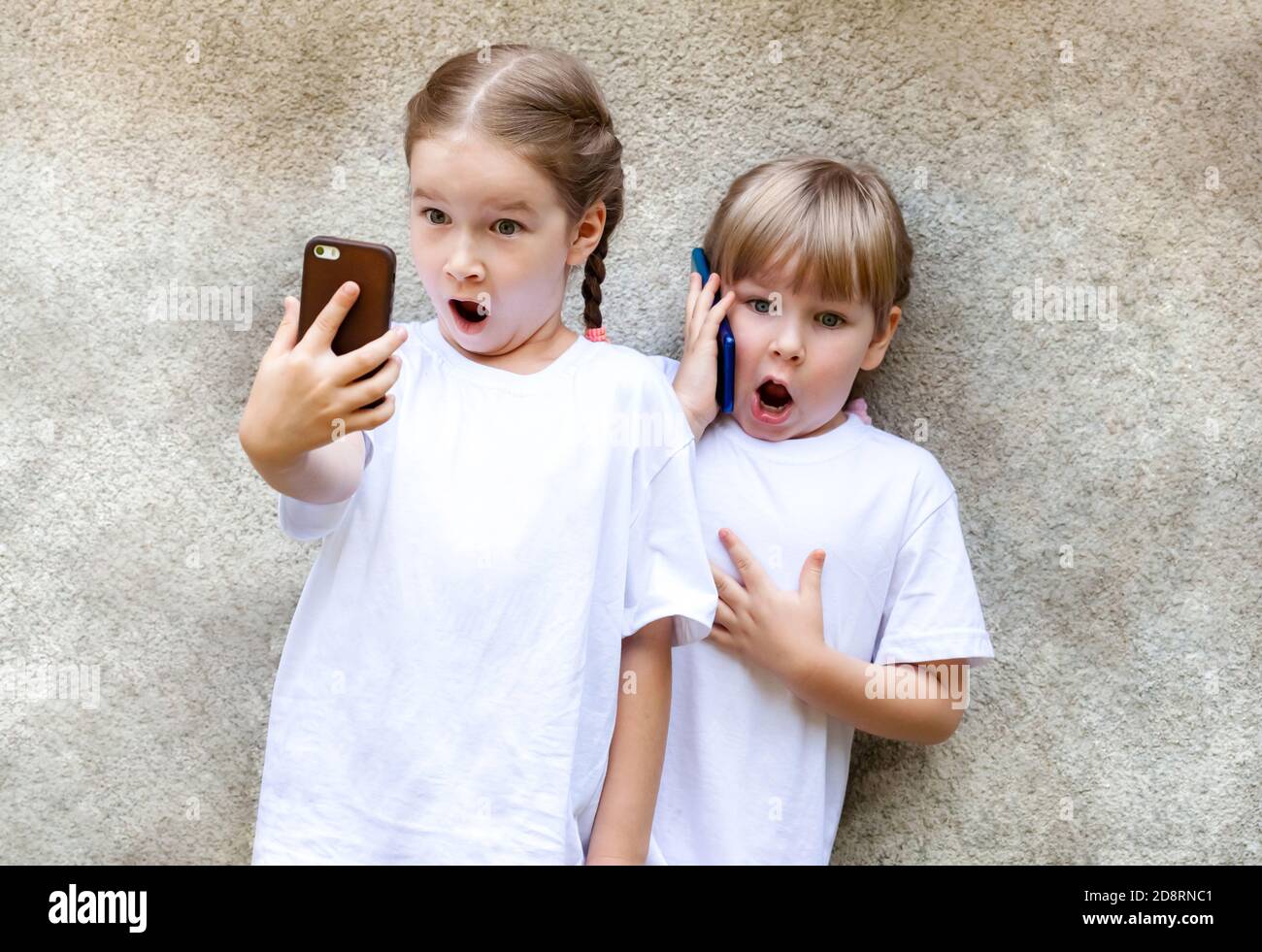 Boy From Belarus Is Using His Smart Phone Indoors Stock Photo