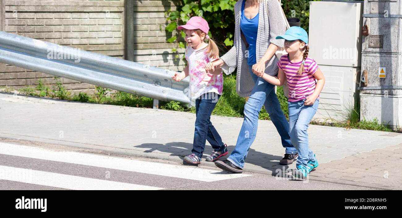 Three girls holding hands hi-res stock photography and images - Alamy