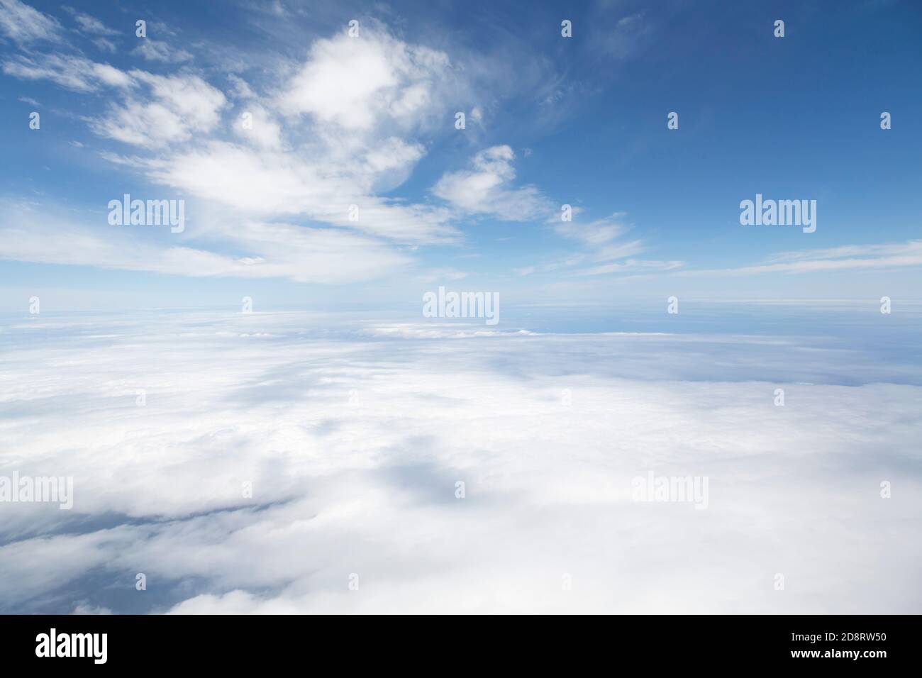 Aerial view flying above clouds. Depicts heaven and Earth concept and the environment Stock Photo