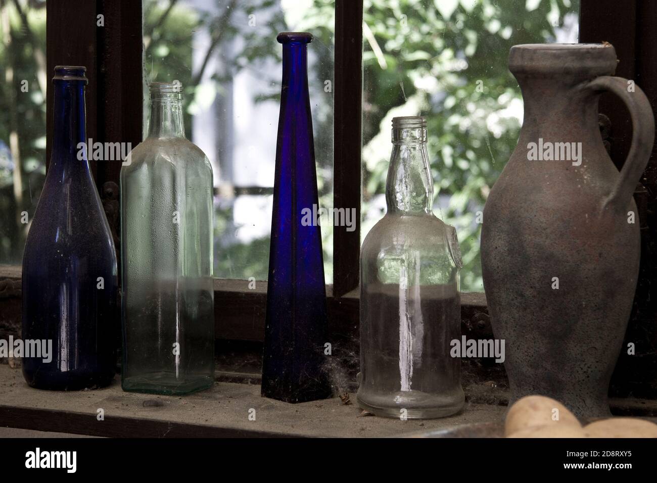 Old bottles on a window sill Stock Photo