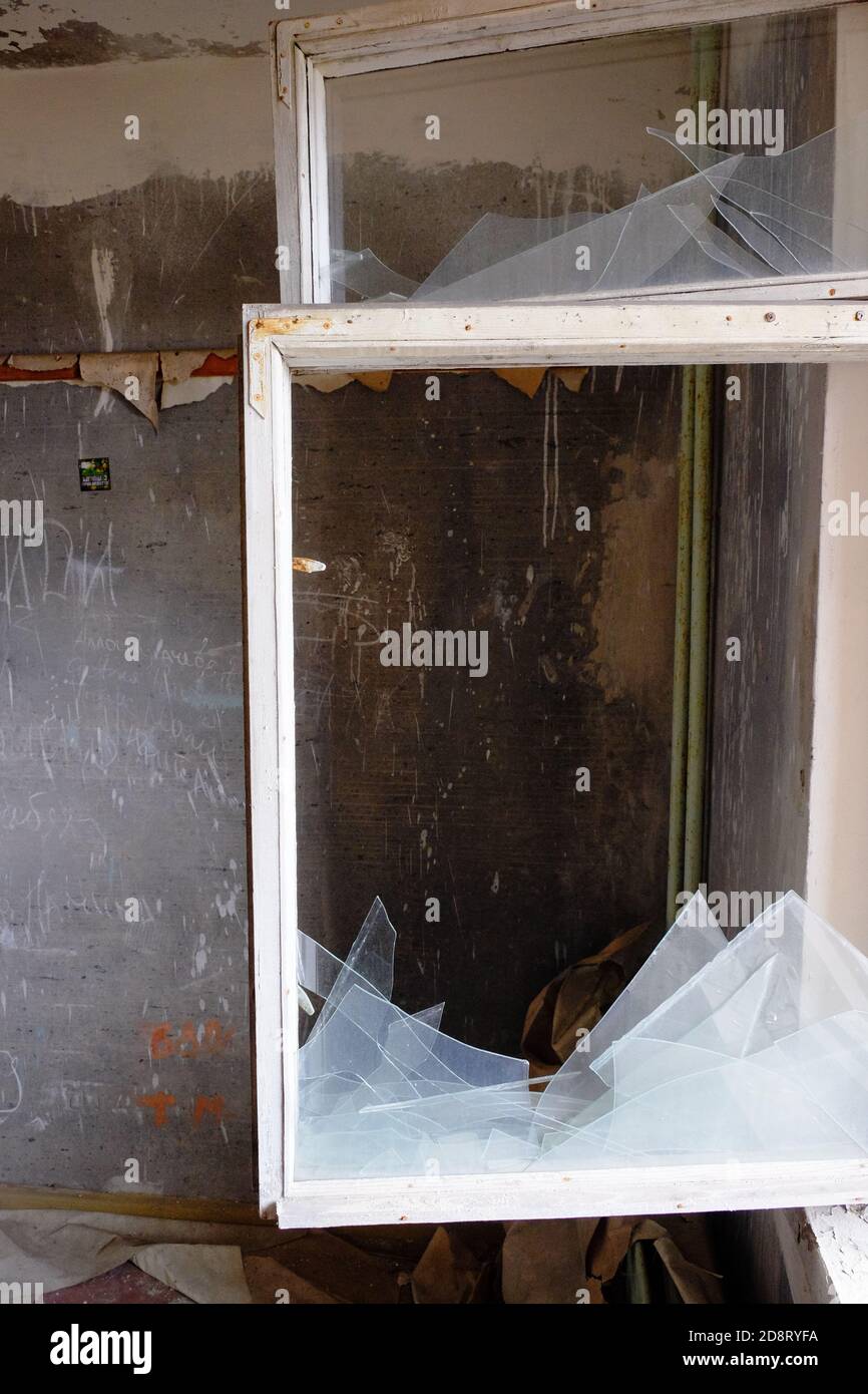 Broken window glass. Old wooden window frame. Shards of broken glass ...