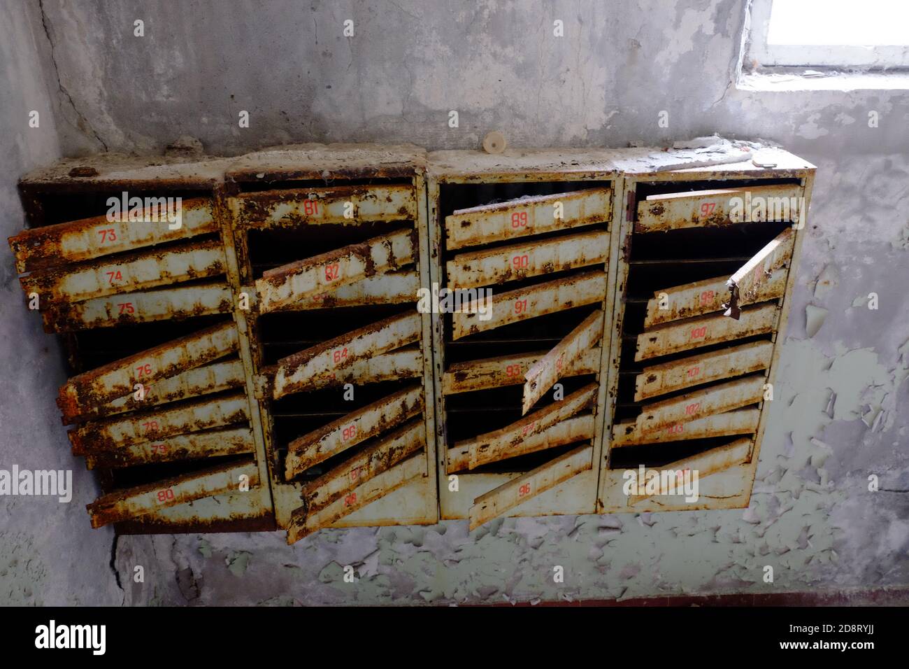 An old broken mailbox in an apartment building Stock Photo Alamy
