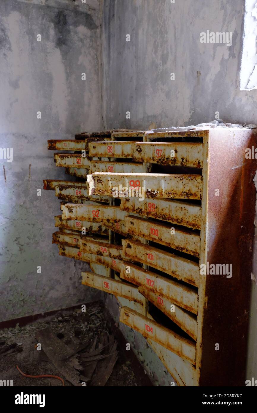 An old broken mailbox in an apartment building Stock Photo Alamy