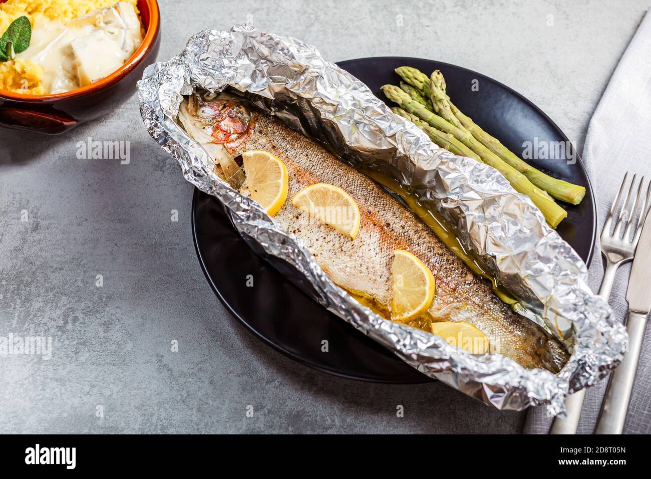 Fresh baked salmon trout in an aluminum foil Stock Photo Alamy
