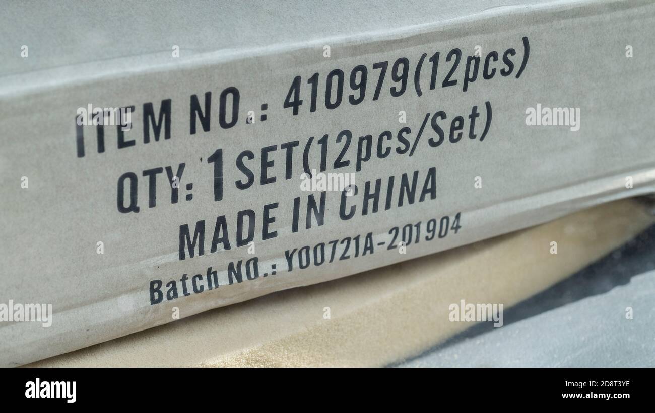 Unknown boxed item seen through car window and bearing the words Made in China. For China exports, China trade, China outsourcing, Chinese exports. Stock Photo