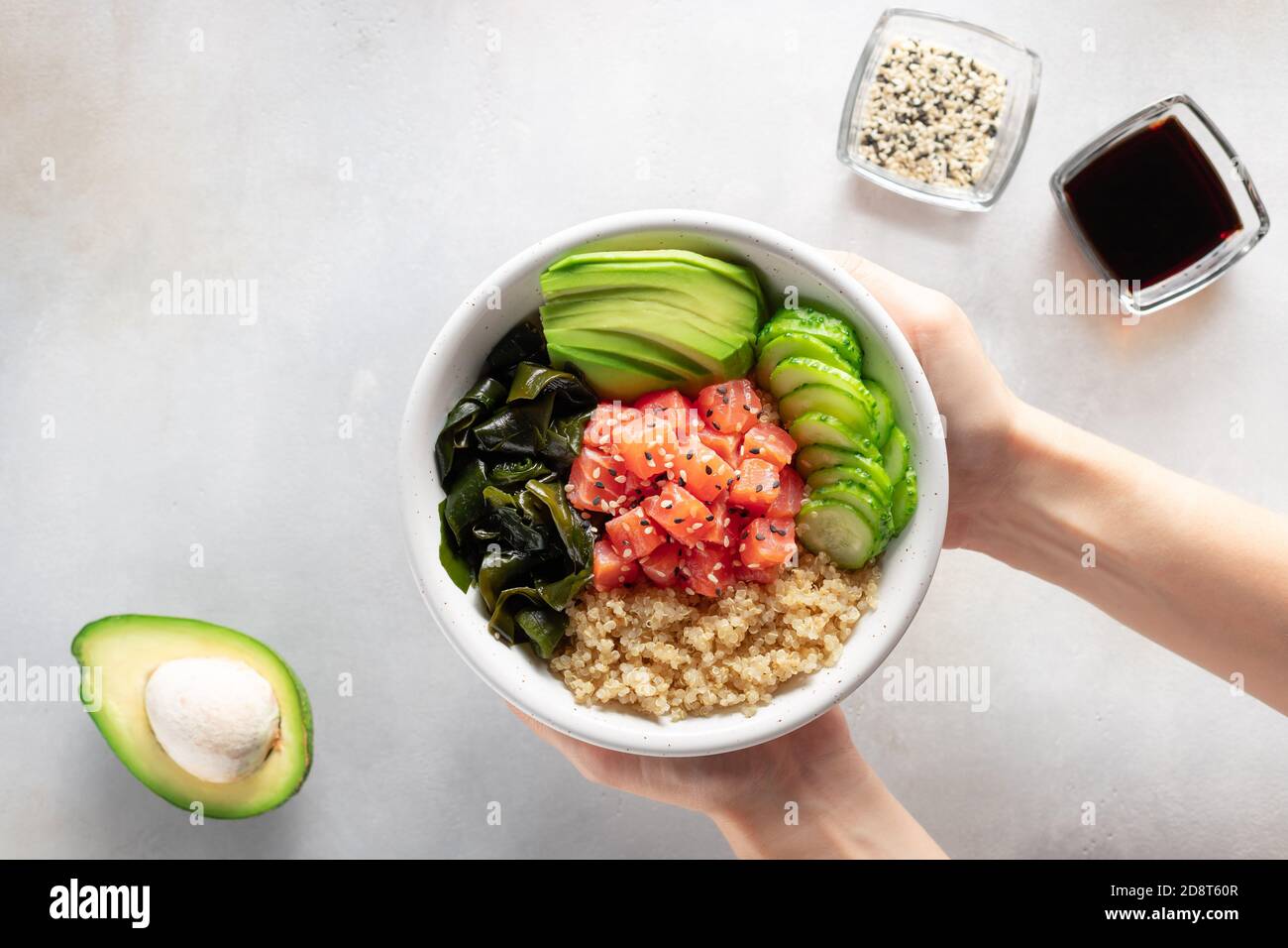 Poke Bowl with quinoa, salmon, avocado and other healthy products. Isolated  on white Stock Photo - Alamy