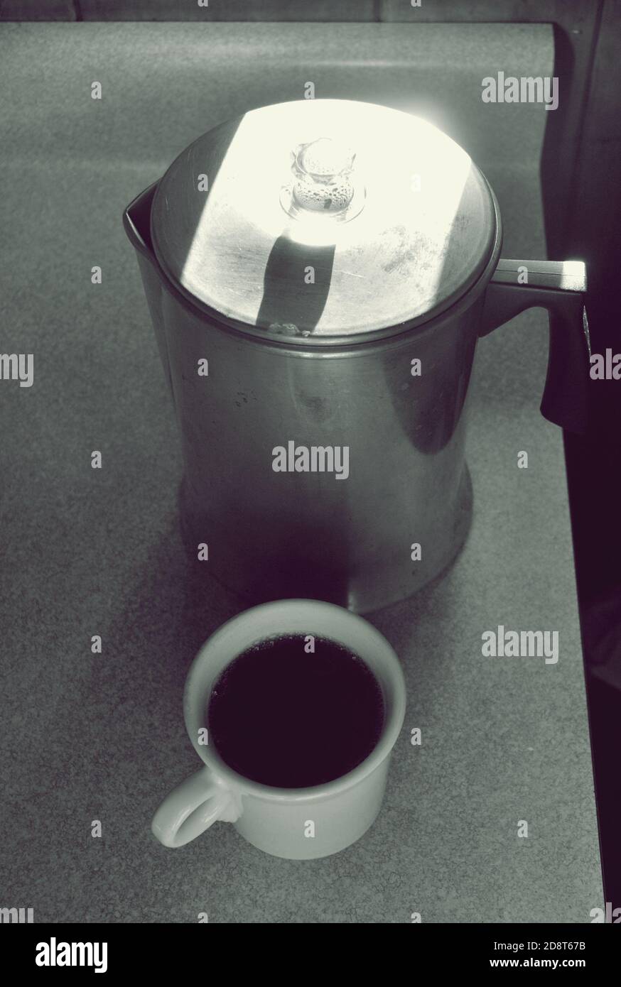 https://c8.alamy.com/comp/2D8T67B/old-fashion-coffee-pot-and-white-mug-with-coffee-in-it-with-black-and-white-filter-2D8T67B.jpg