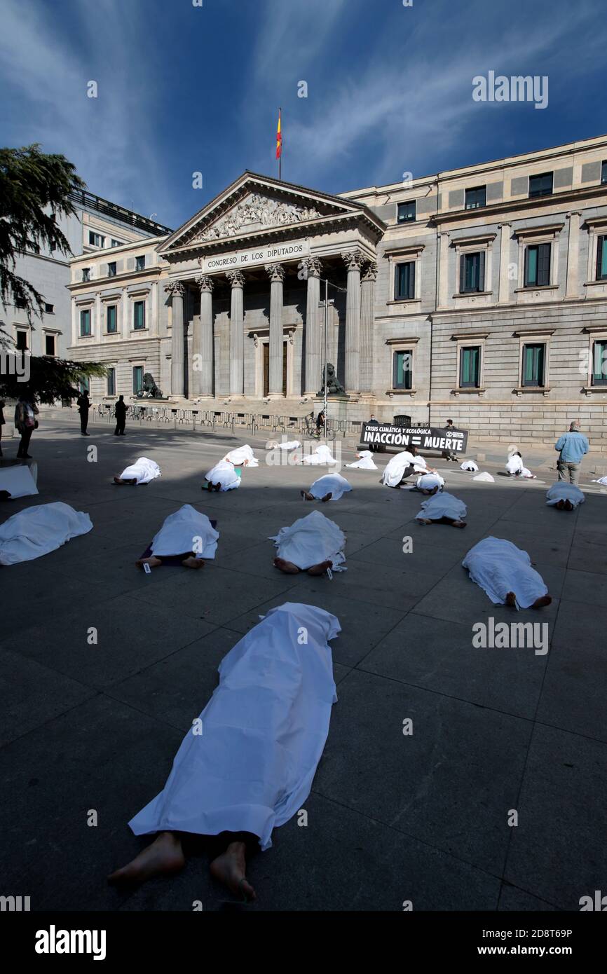 Madrid, Spain, 01/11/2020.- Extinction Rebellion exposes symbolic corpses  in front of the Spanish Parliament in Madrid, coinciding with All Saints'  Day, to make visible all the causes of death related to the
