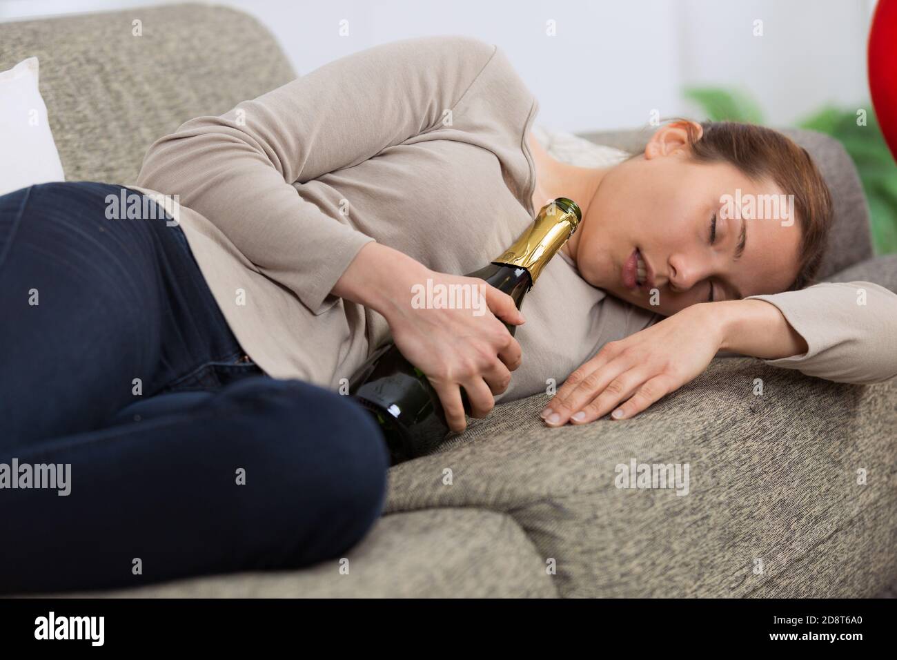 wasted alcoholic woman drunk sleeping at home sofa Stock Photo Alamy