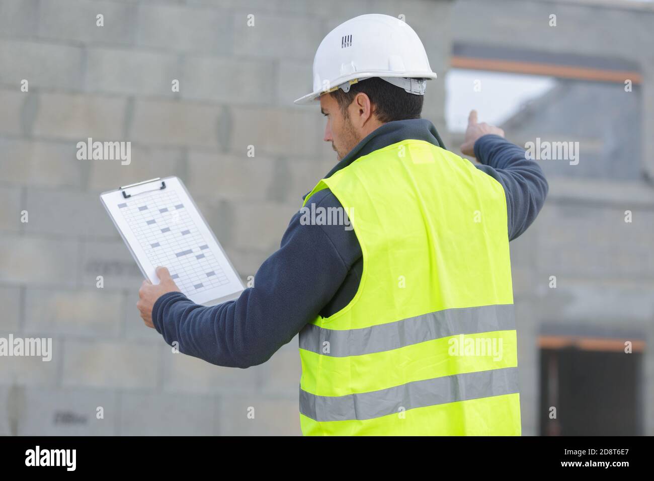 an engineer pointing at something Stock Photo