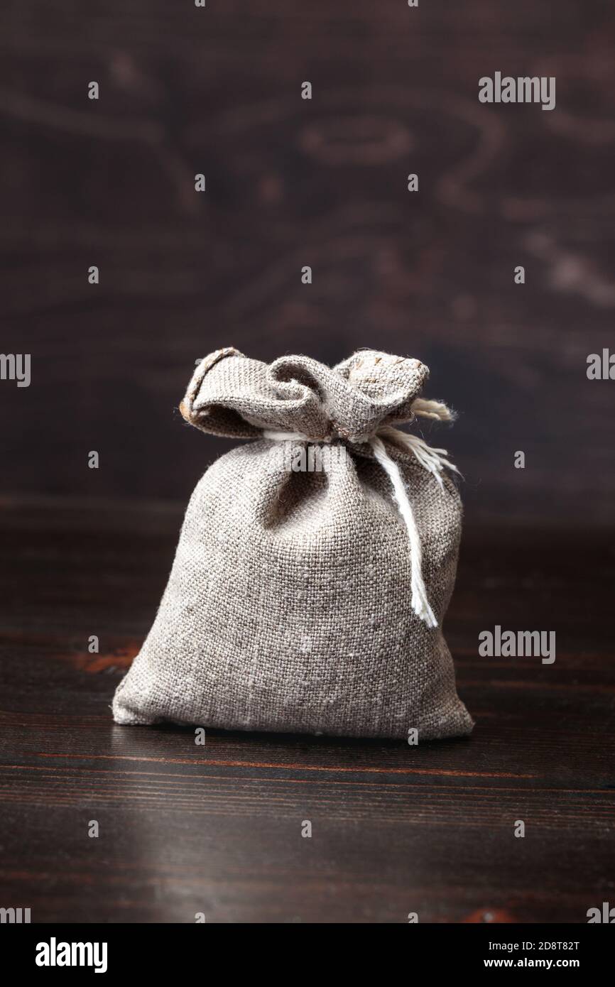 Small pouch on old table Stock Photo