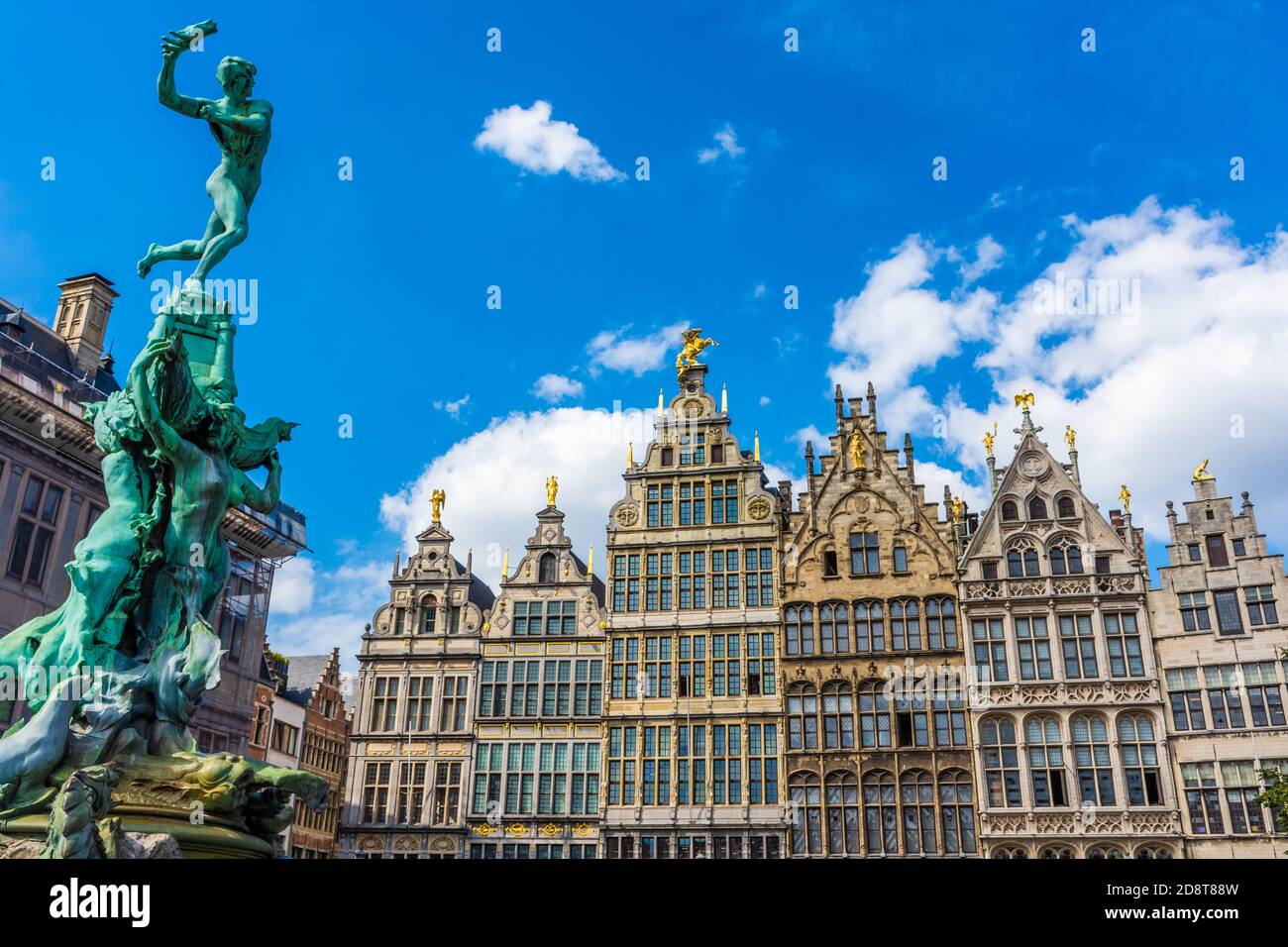 Ancient statue and historical buildings of Antwerp, Belgium Stock Photo ...