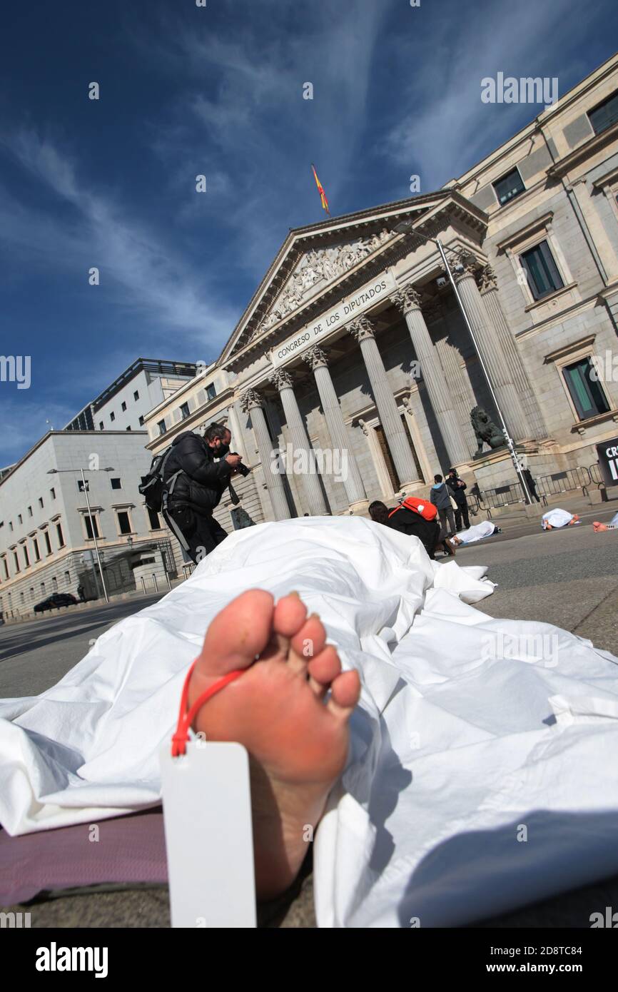 Madrid, Spain, 01/11/2020.- Extinction Rebellion exposes symbolic corpses  in front of the Spanish Parliament in Madrid, coinciding with All Saints'  Day, to make visible all the causes of death related to the