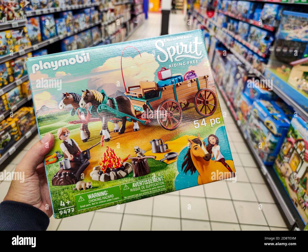 Puilboreau, France - October 14, 2020: Closeup of Man hand buying Playmobil  figurine Lego brand display for sell in french supermarket Stock Photo -  Alamy