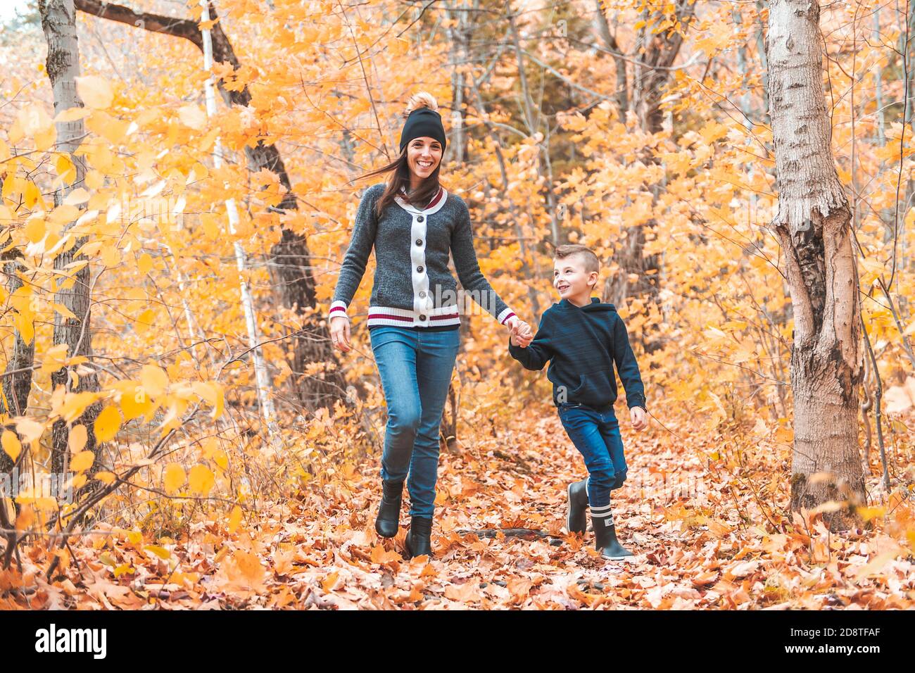 A portrait of a mother with child in the autumn park Stock Photo - Alamy