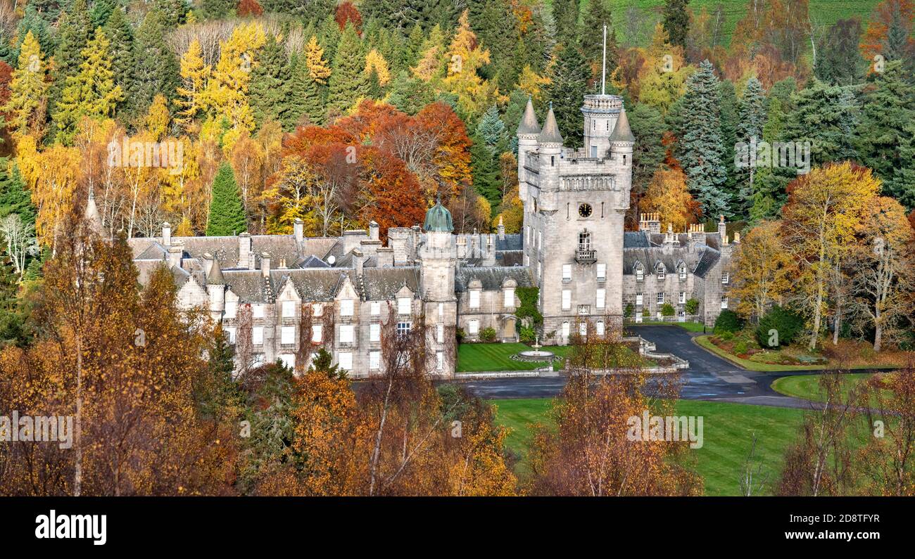 BALMORAL CASTLE AND ESTATE ROYAL DEESIDE ABERDEENSHIRE SCOTLAND SURROUNDED BY COLOURFUL BIRCH TREES AND FIR TREES IN AUTUMN Stock Photo