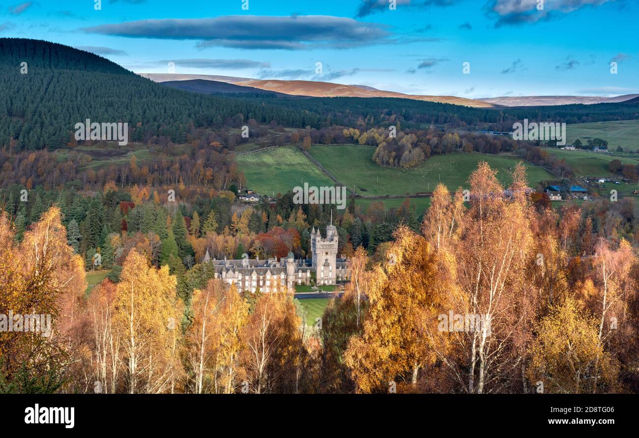 BALMORAL CASTLE AND ESTATE SURROUNDED BY COLOURFUL BIRCH TREES IN AUTUMN Stock Photo