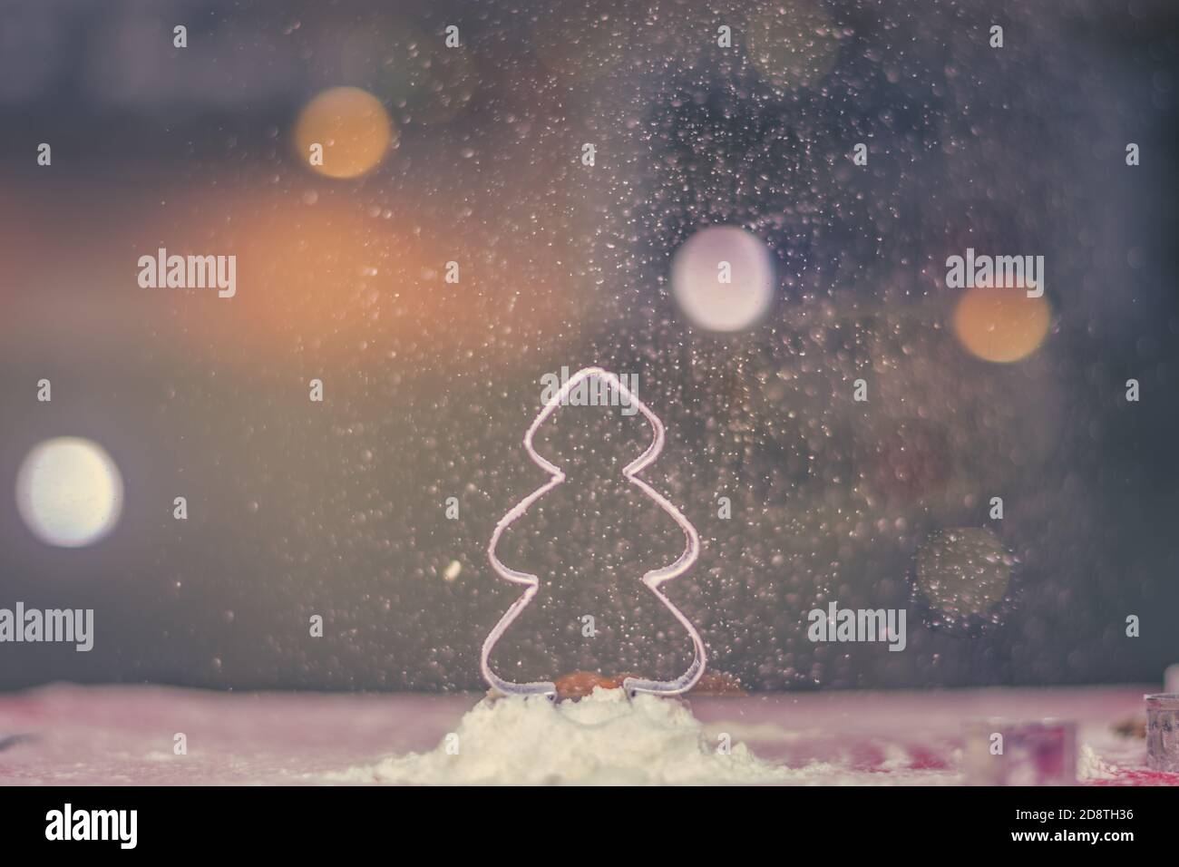 christmas tree mold shape with falling flour snow and bokeh background Stock Photo Alamy