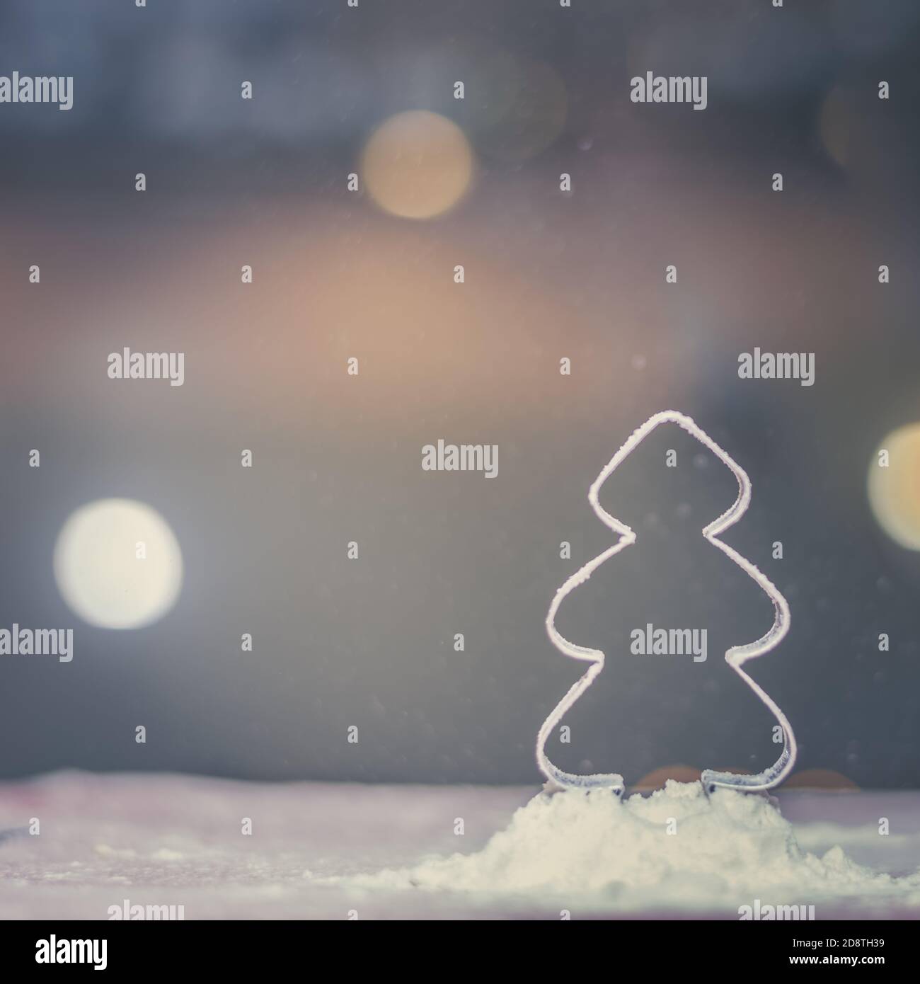 christmas tree mold shape with falling flour snow and bokeh background Stock Photo Alamy