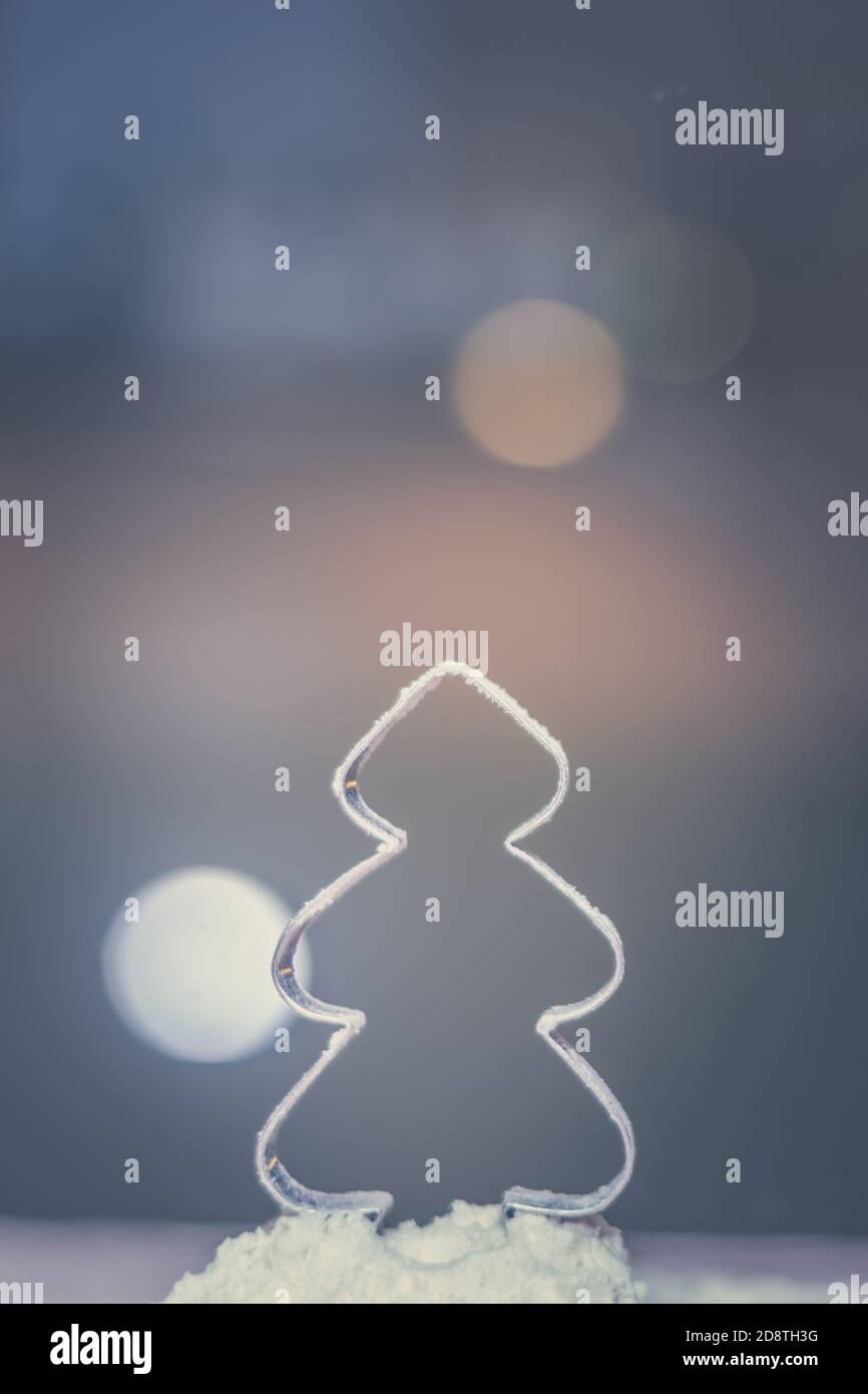 christmas tree mold shape with falling flour snow and bokeh background Stock Photo Alamy